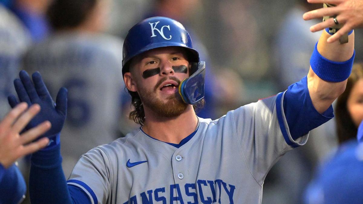 Kansas City Royals shortstop Bobby Witt Jr. (7) is greeted in the dugout after scoring during the first inning against the Los Angeles Angels at Angel Stadium.