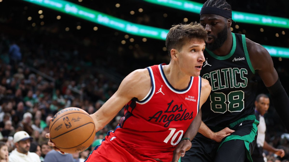 Los Angeles Clippers guard Bogdan Bogdanovic (10) drives to the basket defended by Boston Celtics center Neemias Queta (88) during the second half at TD Garden.