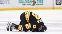 Boston Bruins center Elias Lindholm (28) on the ice after an apparent injury during the second period against the Buffalo Sabres at TD Garden.
