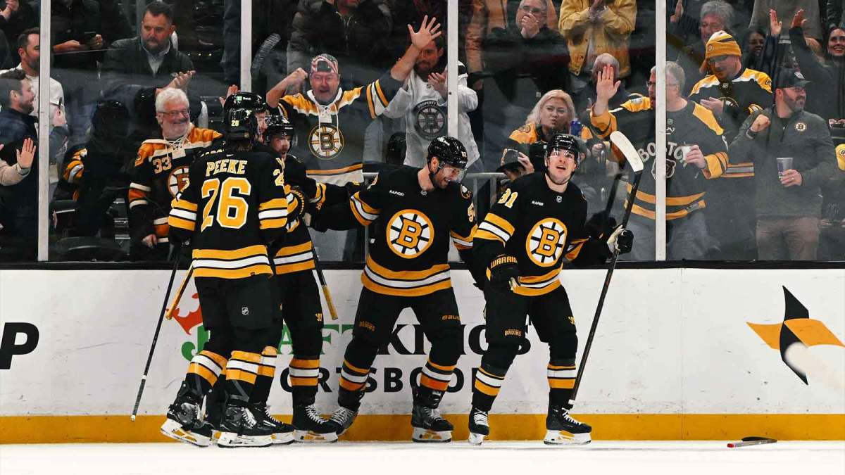 Boston Bruins center Sean Kuraly (52) celebrates with teammates after scoring a goal against the Ottawa Senators during the second period at the TD Garden.