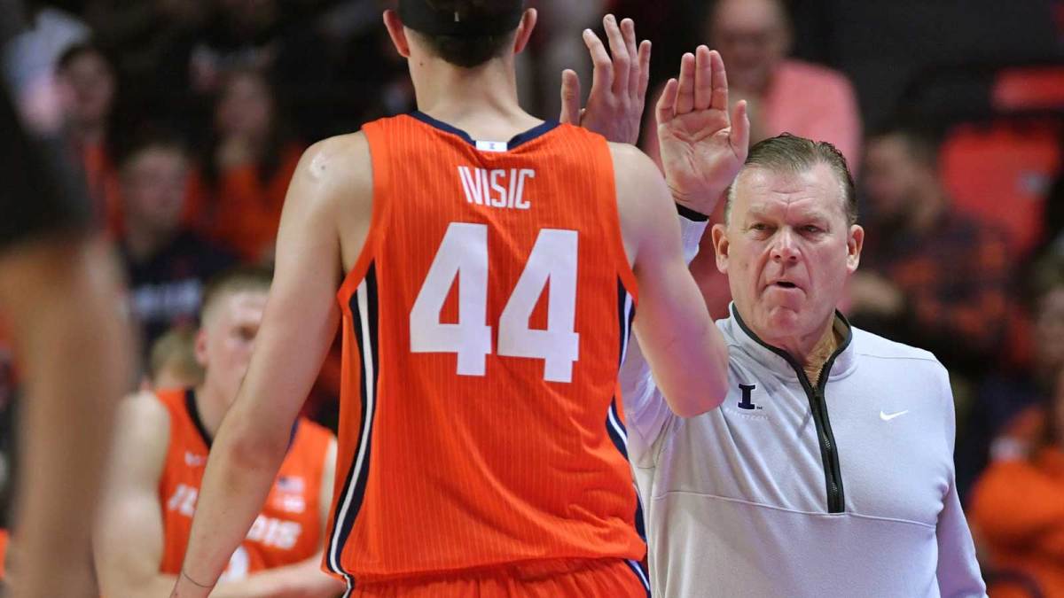 Illinois Fighting Illini head coach Brad Underwood gives player Illinois Fighting Illini forward Zvonimir Ivisic (44) a hand during the first half against the UT Rio Grande Valley Vaqueros at State Farm Center.