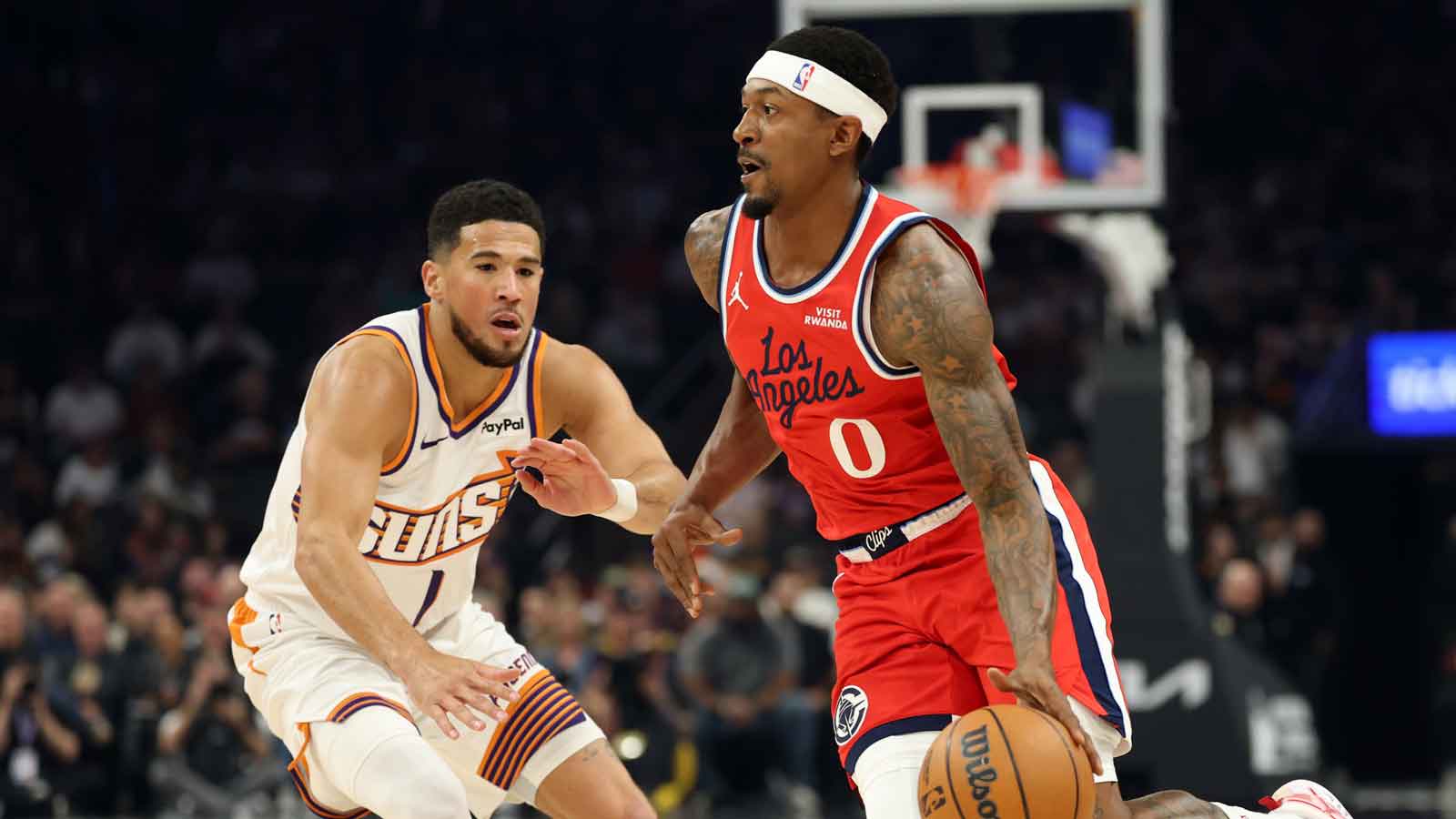 Los Angeles Clippers guard Bradley Beal (0) against Phoenix Suns guard Devin Booker (1) in the first half at the Mortgage Matchup Center.
