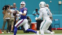 Buffalo Bills quarterback Josh Allen (17) scrambles against Miami Dolphins linebacker Bradley Chubb (2) during the first half at Hard Rock Stadium.