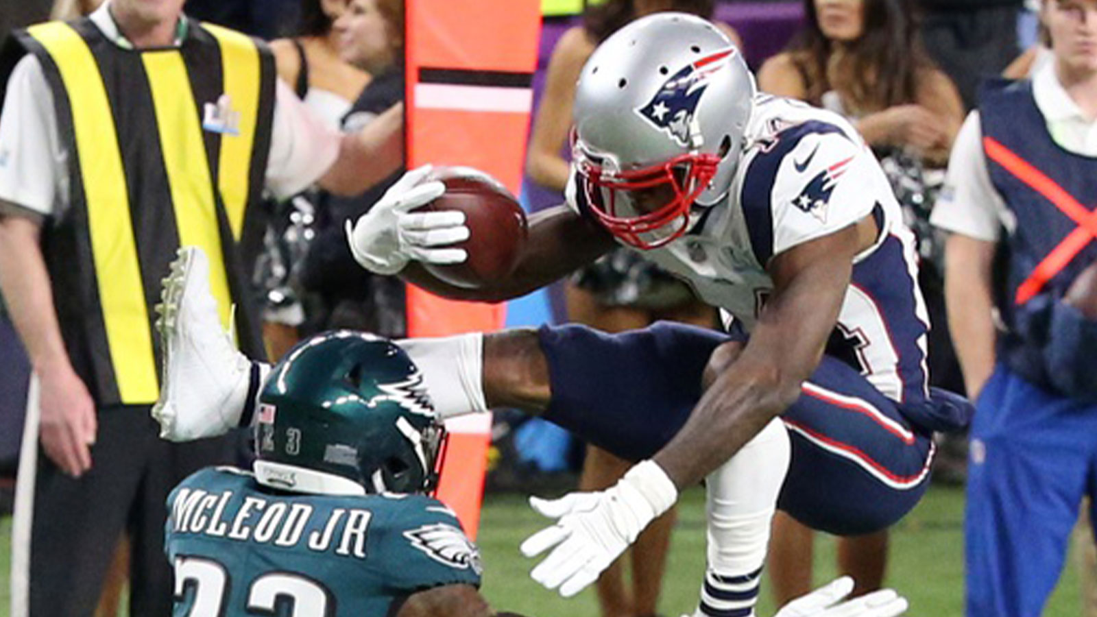 New England Patriots wide receiver Brandin Cooks (14) attempts to jump over Philadelphia Eagles free safety Rodney McLeod (23) during the second quarter in Super Bowl LII at U.S. Bank Stadium.