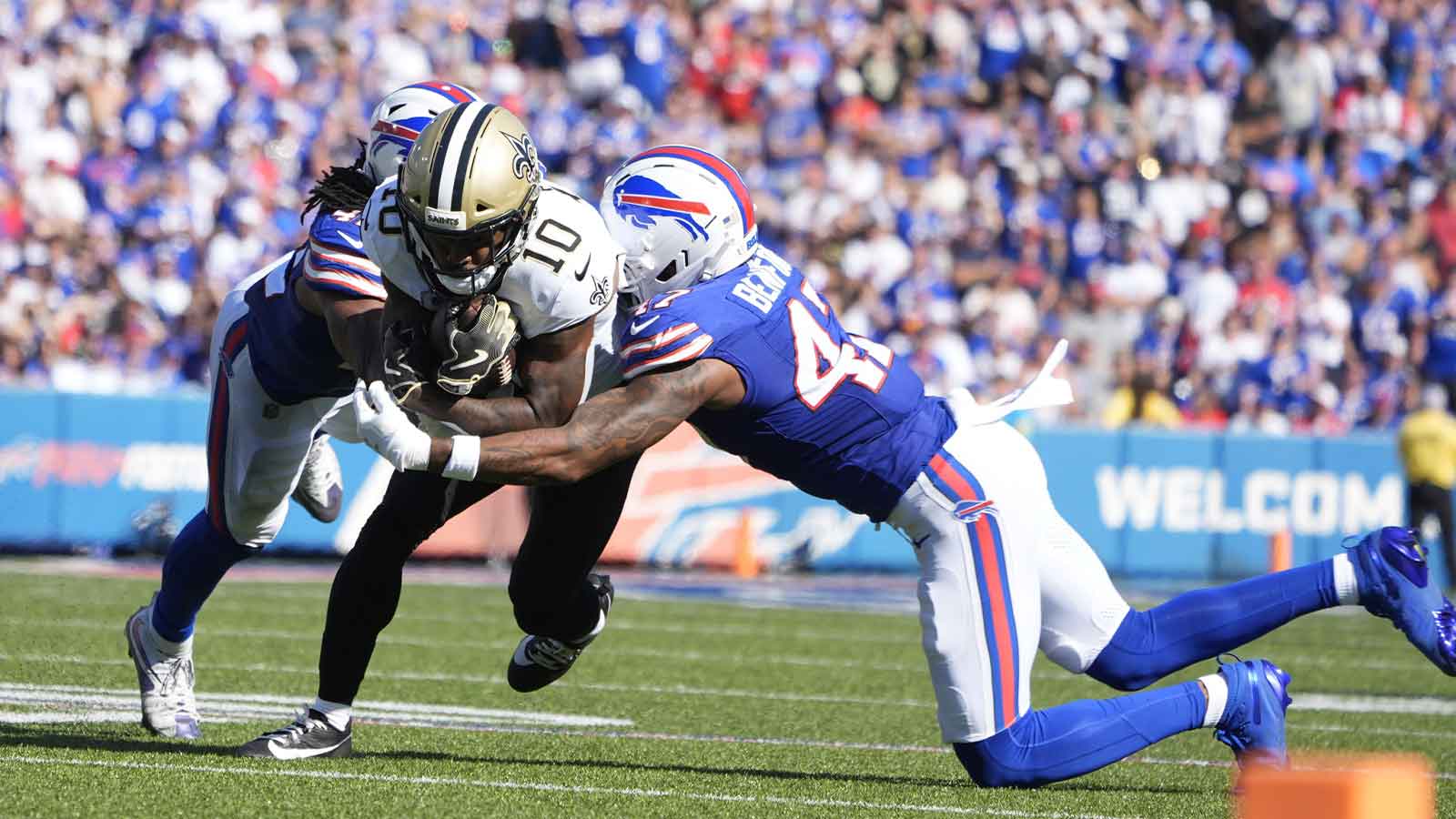 New Orleans Saints wide receiver Brandin Cooks (10) is tackled by Buffalo Bills cornerback Christian Benford (47) and linebacker Dorian Williams (42) during the fourth quarter at Highmark Stadium. 