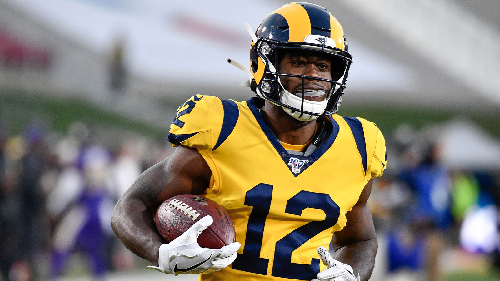 Los Angeles Rams wide receiver Brandin Cooks (12) jogs down the field during pregame warmups before the Rams game against the Baltimore Ravens at Los Angeles Memorial Coliseum.