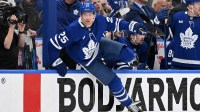 Toronto Maple Leafs defenseman Brandon Carlo (25) vaults the boards as he changes on the fly against the Ottawa Senators in the second period in game two of the first round of the 2025 Stanley Cup Playoffs at Scotiabank Arena.