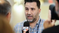 Atlanta Braves general manager Alex Anthopoulos answers questions from the media during the MLB GM Meetings at The Conrad Las Vegas.