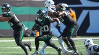 New York Jets running back Breece Hall (20) carries the ball against the Dallas Cowboys during the first half at MetLife Stadium.