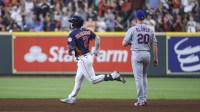 New York Mets first baseman Pete Alonso (20) looks on as Houston Astros third baseman Alex Bregman (2) rounds the bases after hitting a home run during the third inning at Minute Maid Park.