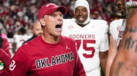 Oklahoma coach Brent Venables celebrates with his players after winning a NCAA football game between the Tennessee Volunteers and Oklahoma Sooners at Neyland Stadium in Knoxville, Tenn., on November 1, 2025.