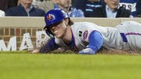 New York Mets third base Brett Baty (7) scores against the Chicago Cubs during the sixth inning at Wrigley Field.