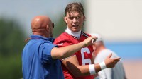 Former New York Giants head coach Brian Daboll and quarterback Jaxson Dart during training camp.