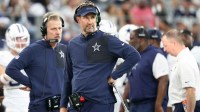 Dallas Cowboys head coach Brian Schottenheimer looks on during the third quarter of the game against the Washington Commanders at AT&T Stadium.