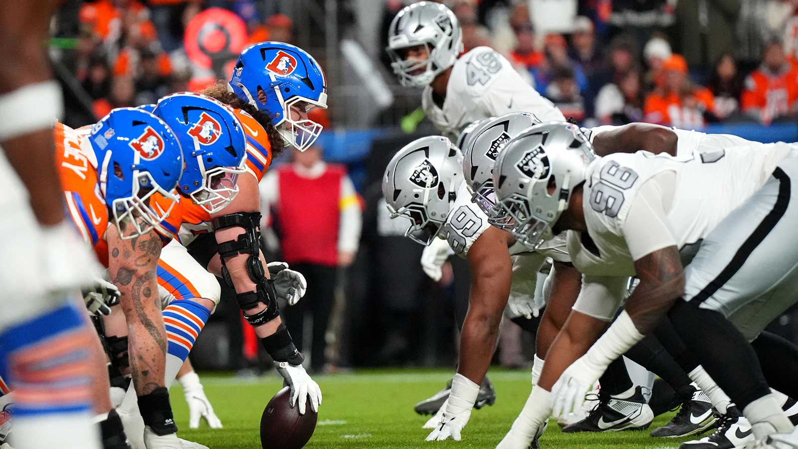 The Denver Broncos offense line up against the Las Vegas Raiders defense during the first half at Empower Field at Mile High.