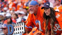 Denver Broncos fans cheer in the second half against the Dallas Cowboys at Empower Field at Mile High.