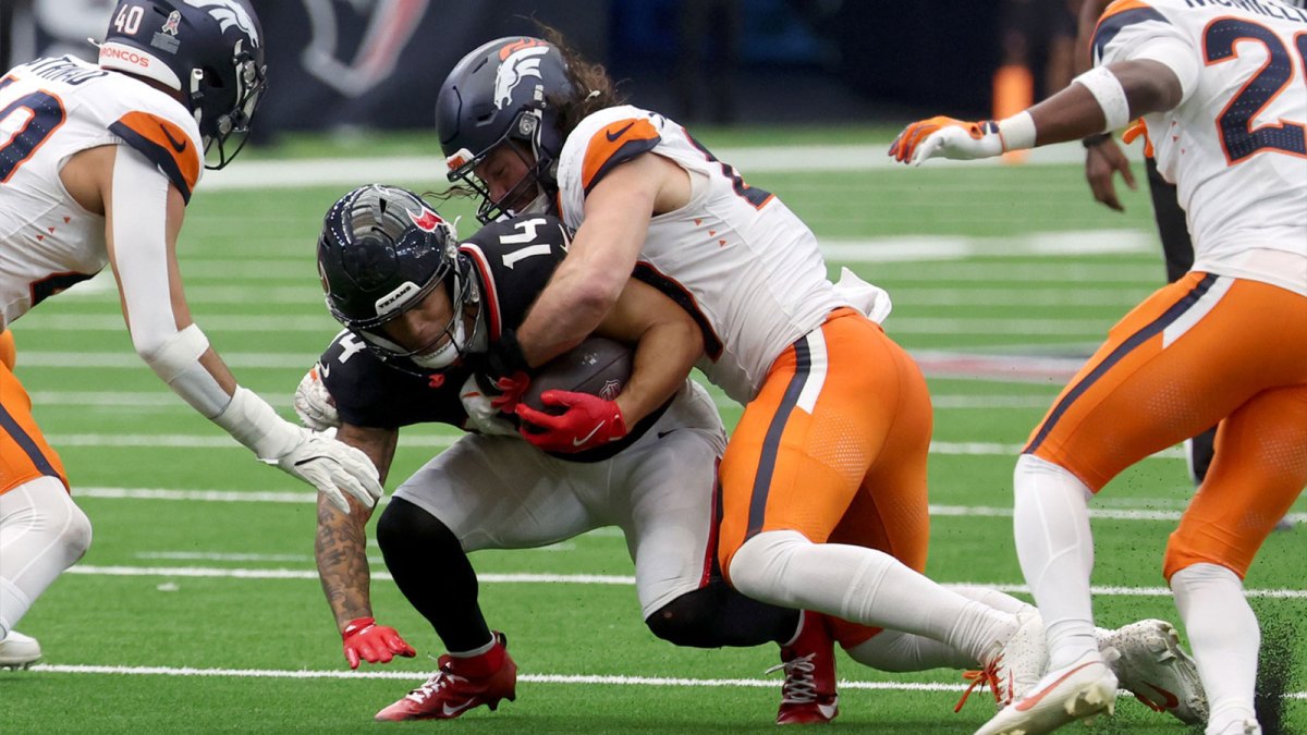 Denver Broncos linebacker Alex Singleton (49) tackles Houston Texans wide receiver Jaylin Noel (14 during the second half at NRG Stadium.