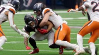 Denver Broncos linebacker Alex Singleton (49) tackles Houston Texans wide receiver Jaylin Noel (14 during the second half at NRG Stadium.