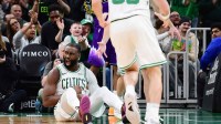 Boston Celtics guard Jaylen Brown (7) reacts after making a basket during the second half against the Utah Jazz at TD Garden