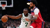 Boston Celtics guard/forward Jaylen Brown (7) drives the ball against Washington Wizards guard/forward Justin Champagnie (9) in the second half at TD Garden.