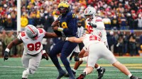 Ohio State Buckeyes defensive end Caden Curry (92) abd defensive tackle Kayden McDonald (98) hit Michigan Wolverines quarterback Bryce Underwood (19) during the NCAA football game at Michigan Stadium in Ann Arbor, Mich.