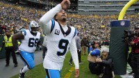Carolina Panthers quarterback Bryce Young (9) takes the field before a game against the Green Bay Packers at Lambeau Field.