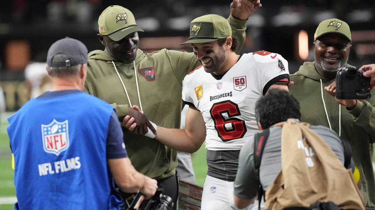 Tampa Bay Buccaneers head coach Todd Bowles and quarterback Baker Mayfield (6) celebrate a win over the New Orleans Saints at Caesars Superdome.