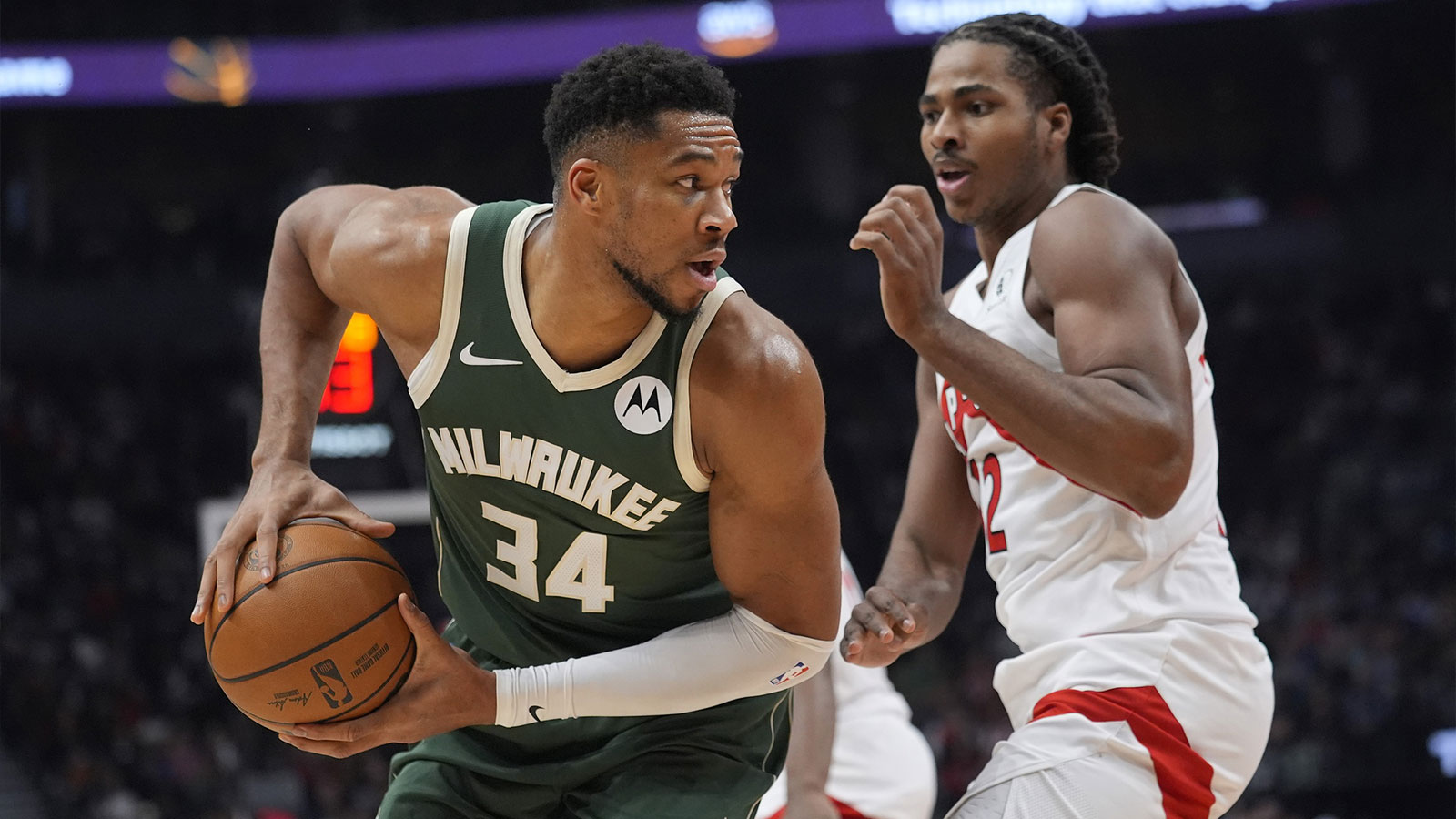 Milwaukee Bucks forward Giannis Antetokounmpo (34) drives tot he net against Toronto Raptors forward Collin Murray-Boyles (12) during the first half at Scotiabank Arena.
