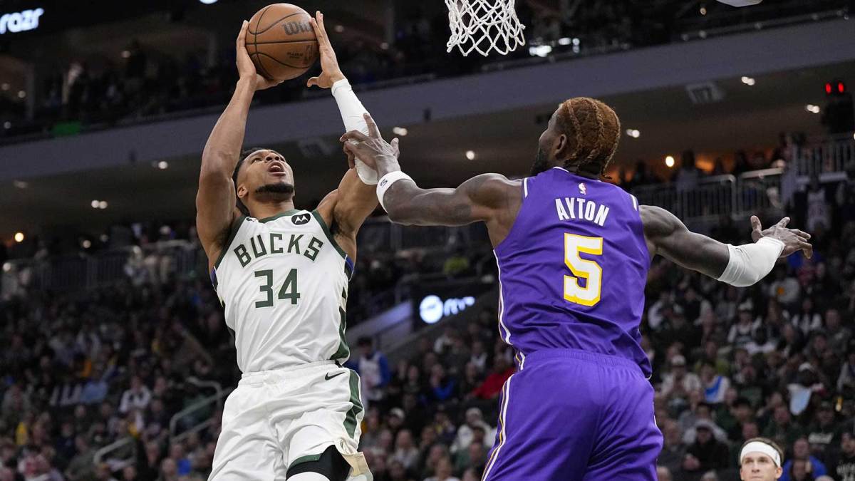 Milwaukee Bucks forward Giannis Antetokounmpo (34) shoots against Los Angeles Lakers center Deandre Ayton (5) during the first quarter at Fiserv Forum.