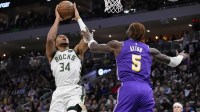 Milwaukee Bucks forward Giannis Antetokounmpo (34) shoots against Los Angeles Lakers center Deandre Ayton (5) during the first quarter at Fiserv Forum.
