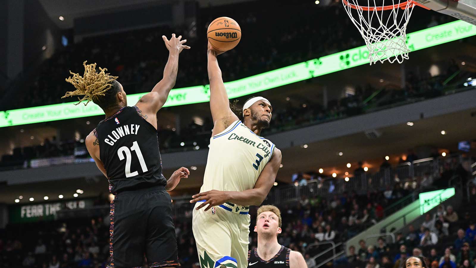 Milwaukee Bucks center Myles Turner (3) dunks the ball against Brooklyn Nets forward Noah Clowney (21) and forward Danny Wolf (2) in the second quarter at Fiserv Forum.