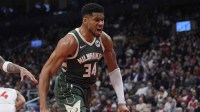 Milwaukee Bucks forward Giannis Antetokounmpo (34) reacts after making a basket against the Toronto Raptors during the first half at Scotiabank Arena.