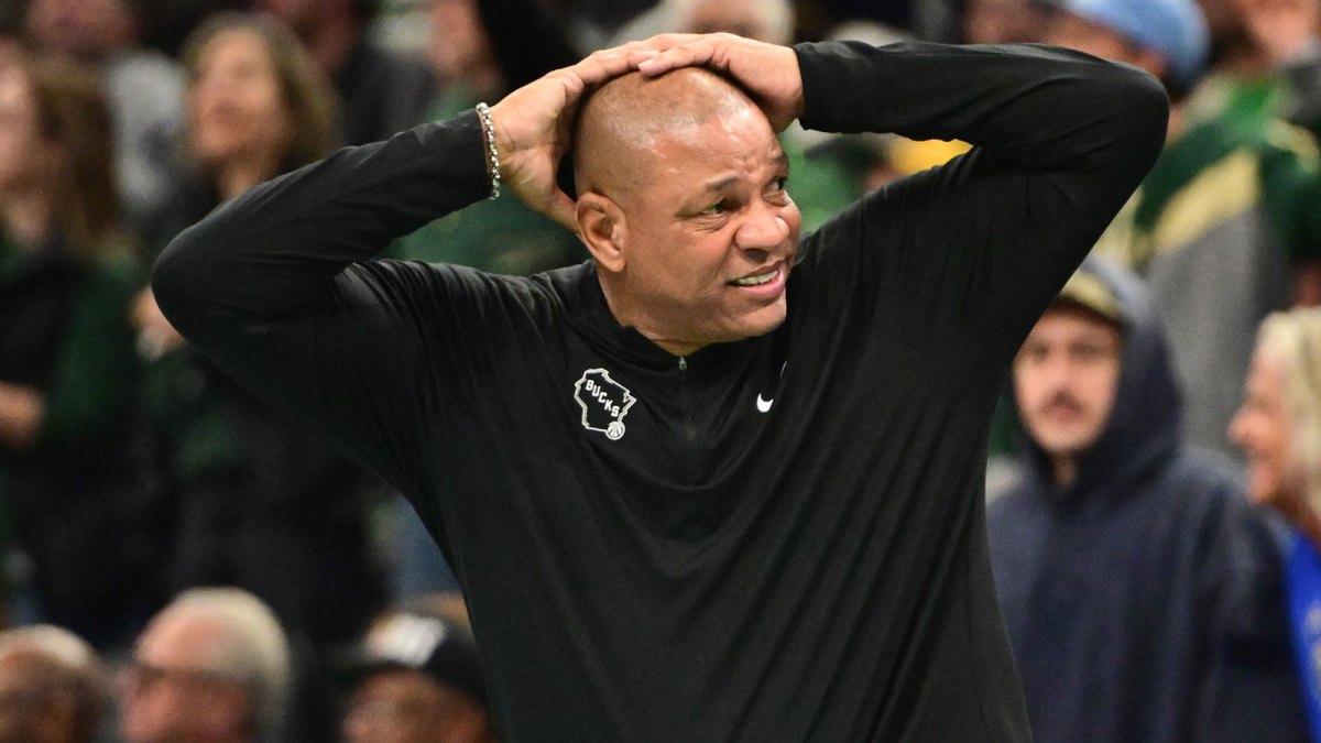 Bucks head coach Doc Rivers reacts in the 4th quarter against the Chicago Bulls at Fiserv Forum with Mavericks' Luka Doncic in the background