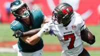 Tampa Bay Buccaneers running back Bucky Irving (7) attempts to stiff arm Philadelphia Eagles cornerback Cooper Dejean (33) during the first quarter at Raymond James Stadium.