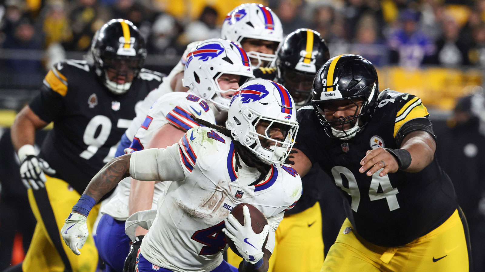 Buffalo Bills running back James Cook III (4) rushes as Pittsburgh Steelers defensive end Yahya Black (94) defends during the fourth quarter at Acrisure Stadium.