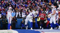 Buffalo Bills offensive tackle Spencer Brown (79) spikes the ball after a Josh Allen touchdown against the Tampa Bay Buccaneers during the second half of the game at Highmark Stadium.