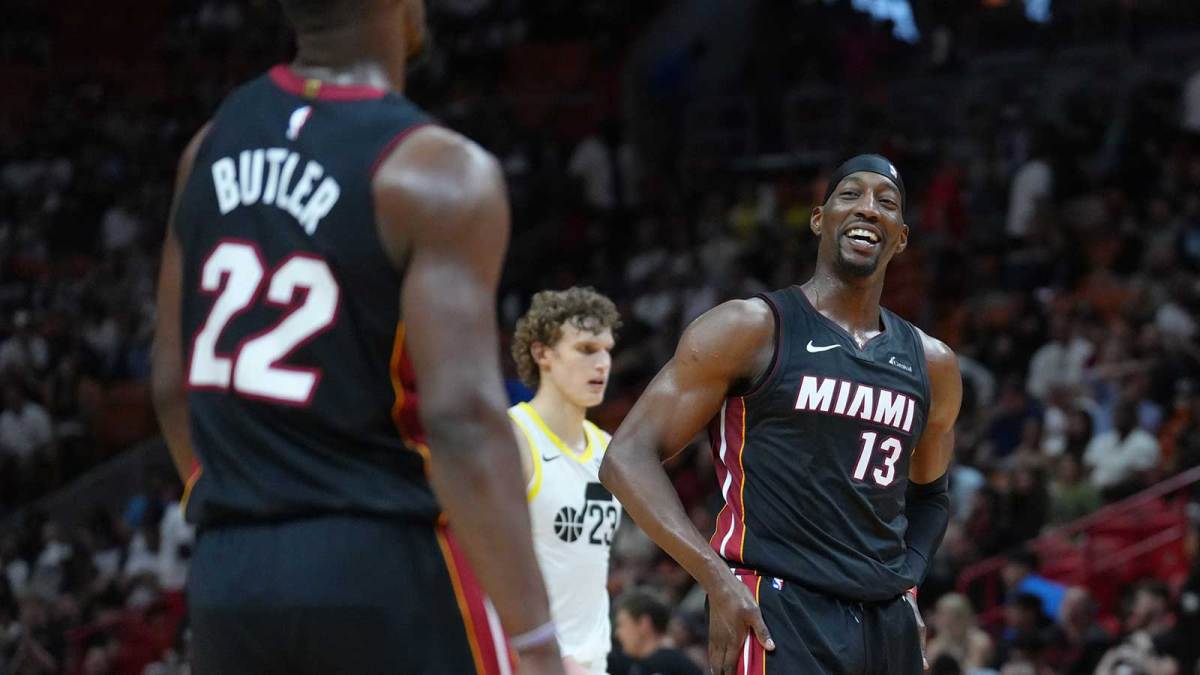 Miami Heat center Bam Adebayo (13) shares a laugh with Miami Heat forward Jimmy Butler (22) in the fourth quarter at Kaseya Center.
