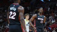 Miami Heat center Bam Adebayo (13) shares a laugh with Miami Heat forward Jimmy Butler (22) in the fourth quarter at Kaseya Center.