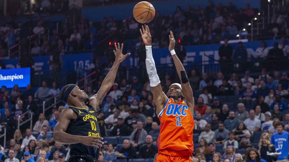 Oklahoma City Thunder guard Shai Gilgeous-Alexander (2) shoots as Golden State Warriors forward Jimmy Butler III (10) defends during the first quarter at Paycom Center.