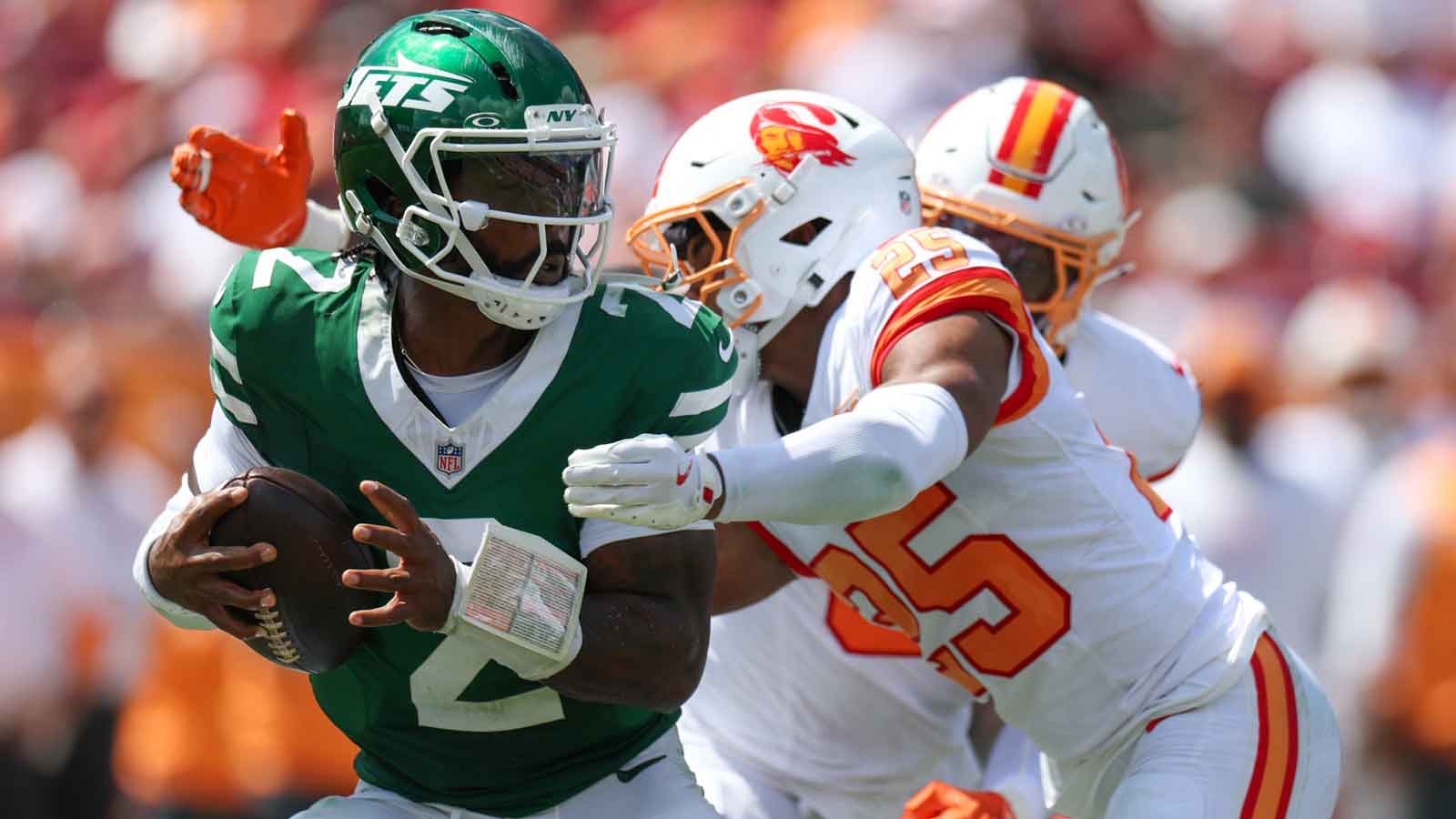 New York Jets quarterback Tyrod Taylor (2) is pressured by Tampa Bay Buccaneers cornerback Jacob Parrish (25) in the second quarter at Raymond James Stadium.