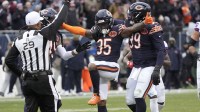 Chicago Bears safety C.J. Gardner-Johnson (35) celebrates with defensive tackle Gervon Dexter Sr. (99) after a sack during the second half against the New York Giants at Soldier Field.