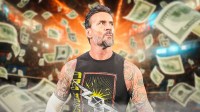 WWE star CM Punk with money all around him.