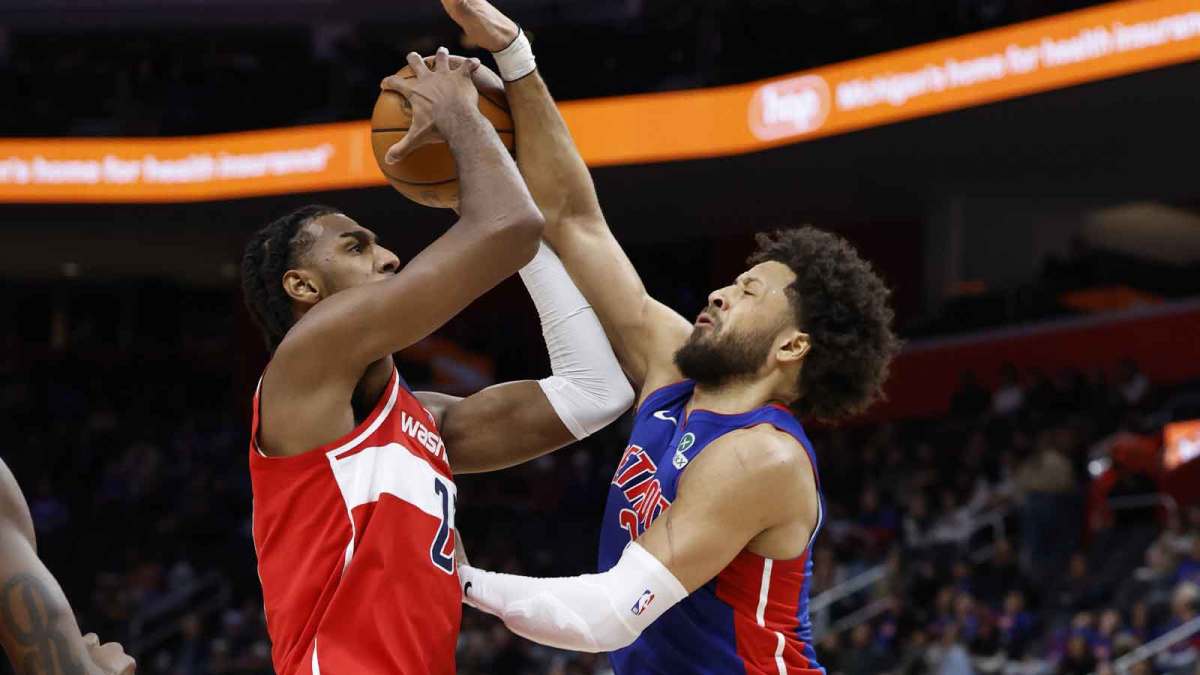 Washington Wizards center Alex Sarr (20) shoots on Detroit Pistons guard Cade Cunningham (2) in the first half at Little Caesars Arena.
