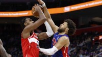 Washington Wizards center Alex Sarr (20) shoots on Detroit Pistons guard Cade Cunningham (2) in the first half at Little Caesars Arena.