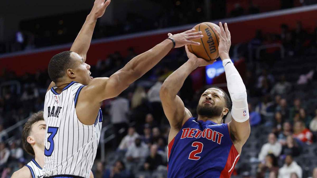 Detroit Pistons guard Cade Cunningham (2) shoots on Orlando Magic guard Desmond Bane (3) in the second half at Little Caesars Arena.