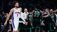 Detroit Pistons guard Cade Cunningham (2) walks back to the bench during a break against the Boston Celtics in the first half at TD Garden.