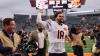Chicago Bears quarterback Caleb Williams (18) acknowledges the crowd and walks off the field after defeating the Cincinnati Bengals in the fourth quarter at Paycor Stadium.