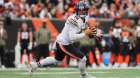 Chicago Bears quarterback Caleb Williams (18) runs and looks to pass the ball against the Cincinnati Bengals during the first quarter at Paycor Stadium.