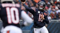 Chicago Bears quarterback Caleb Williams (18) drops back to pass against the New York Giants during the first half at Soldier Field.