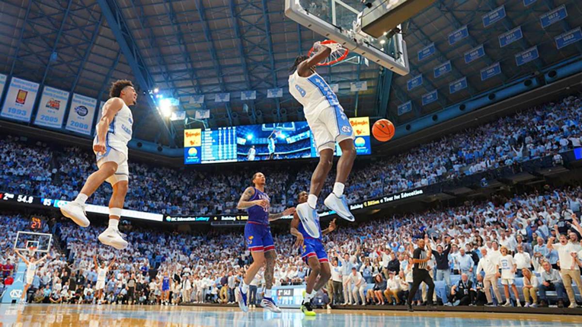 North Carolina Tar Heels forward Caleb Wilson (8) dunks the ball as guard Seth Trimble (7) jumps in the background near the end of the second half at Dean E. Smith Center.